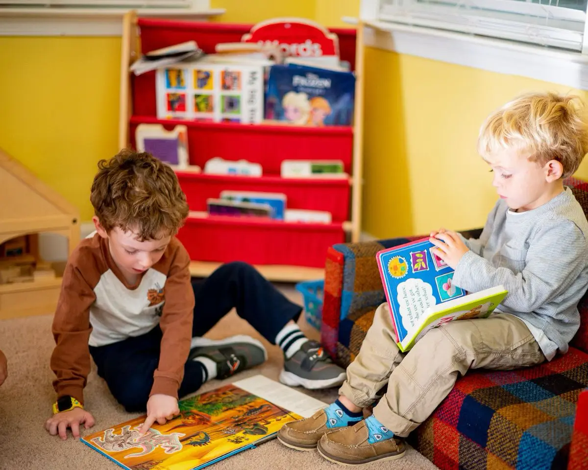 Two Little School boys reading books together