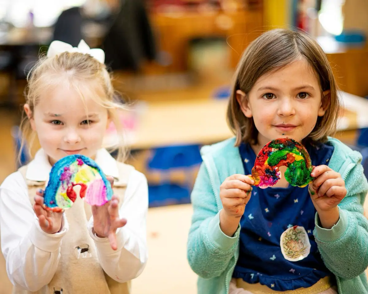Little School students displaying their artwork