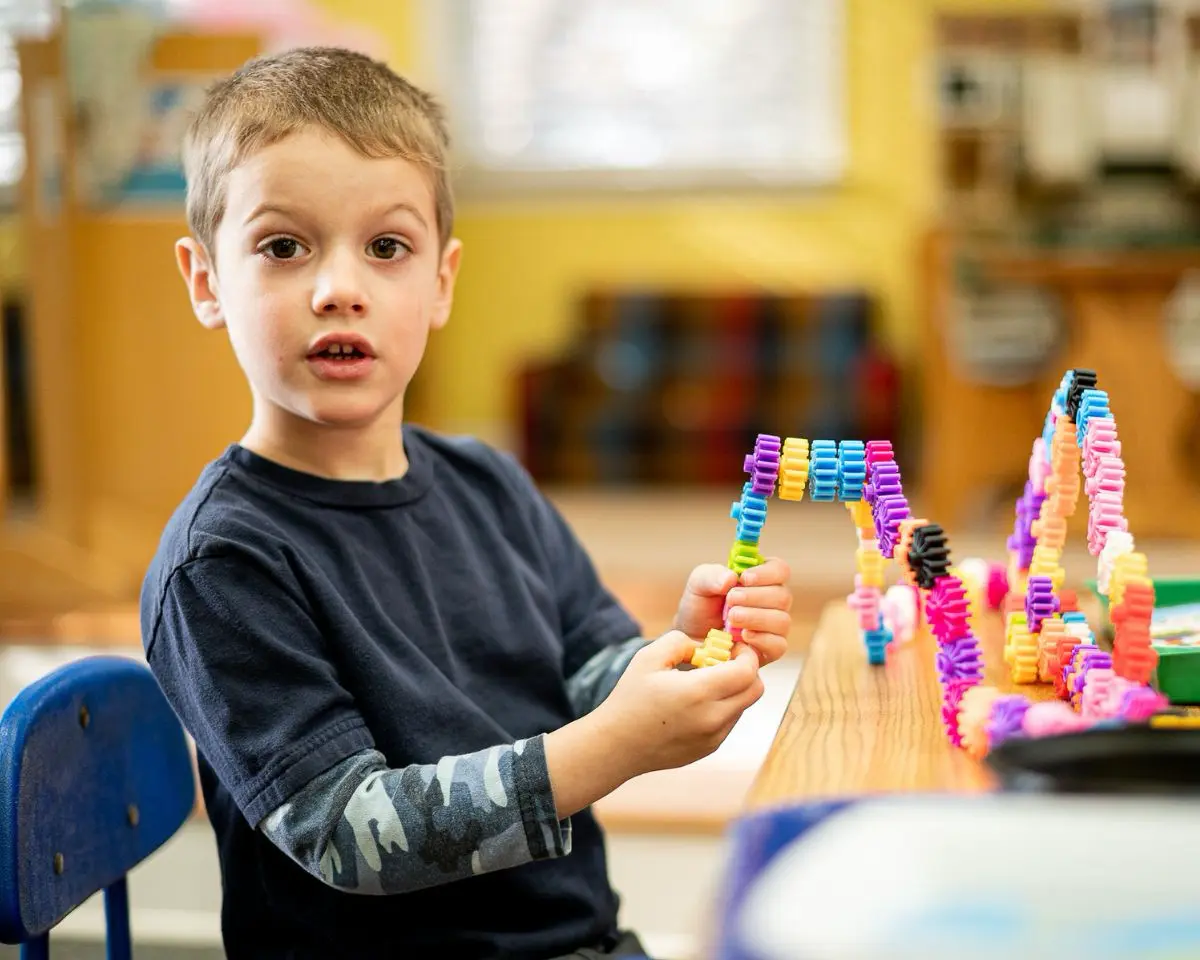 Little School boy building with blocks
